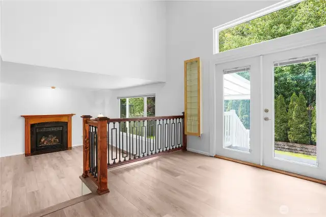 Kitchen and breakfast area lead to backyard, and to split lower level