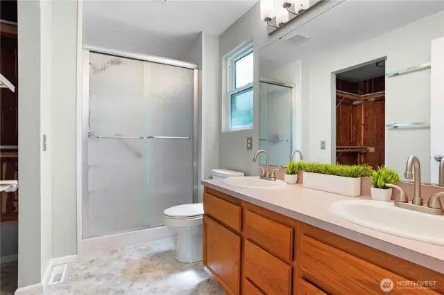 Primary Ensuite with 3/4 bath, double vanity, and walk in CEDAR closet!