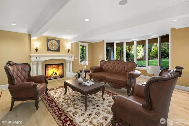 Enjoy the Holidays and Family in this wonderful formal living room with beautiful oversized fireplace. Oh by the way the Xmas Tree looks great in the Custom Bow Window with Xmas stockings hanging on the mantle.