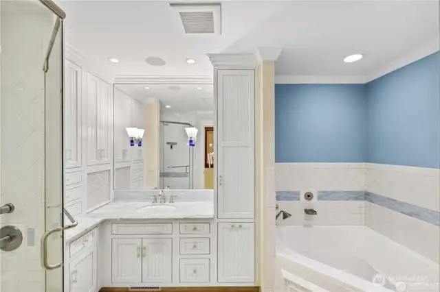 Separate Childrens full bathroom with heated flooring.Canyon Creek cabinets with crown molding. One of a kind Canadian blue marble counters. Tambour door storage area.