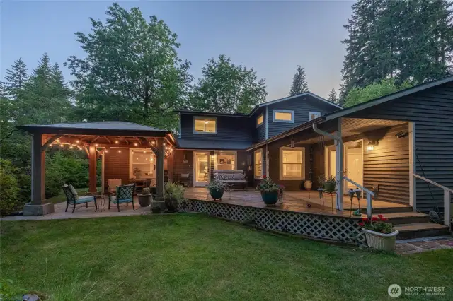Entertaining is a breeze this Summer with an expansive deck and covered patio.
