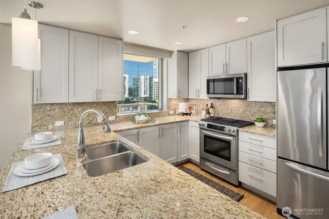 The Kitchen has Granite counters, stainless steel appliances and painted cabinets.