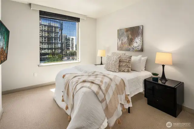 The primary bedroom with city view.