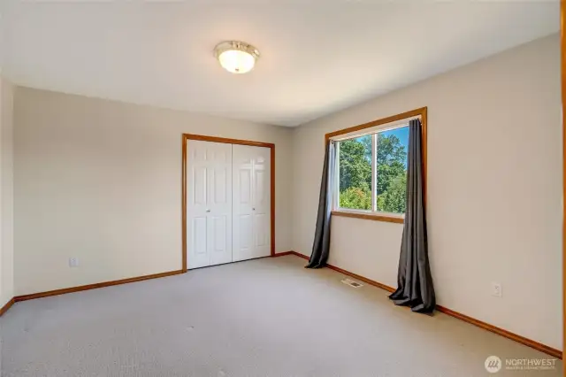 Main-Level Bedroom Featuring Closet and Direct Bathroom Entry