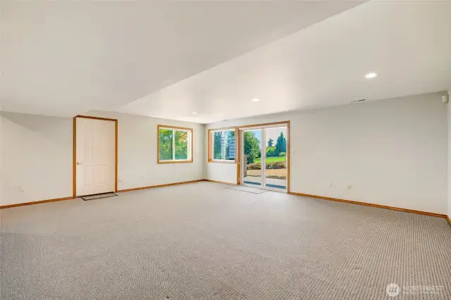 Spacious basement with direct access to the backyard patio, plus additional storage and a crawlspace.