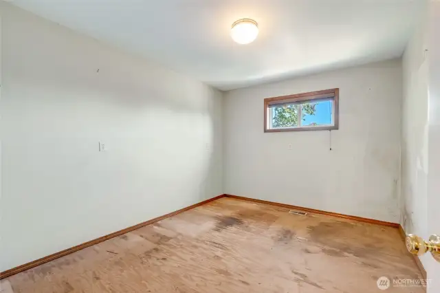 Workshop room off garage, perfect for hobbies, projects, or extra storage.