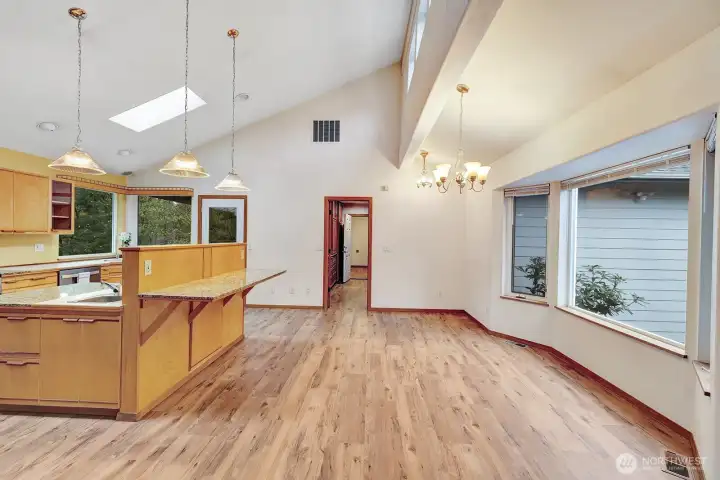 Large open kitchen/diningroom with eating island.
