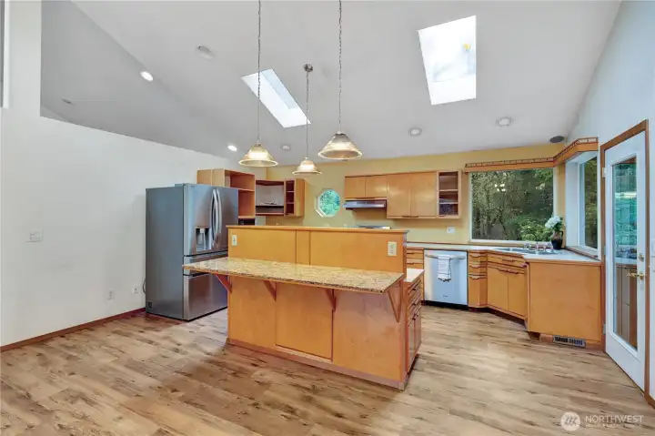 Kitchen opens to covered deck.