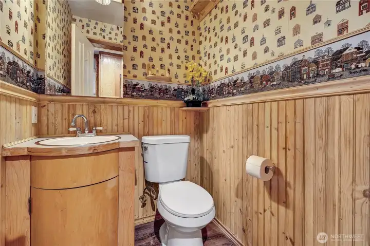Half bath off kitchen in pantry area.