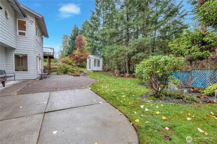 Large entertainment sized patio, and greenhouse.
