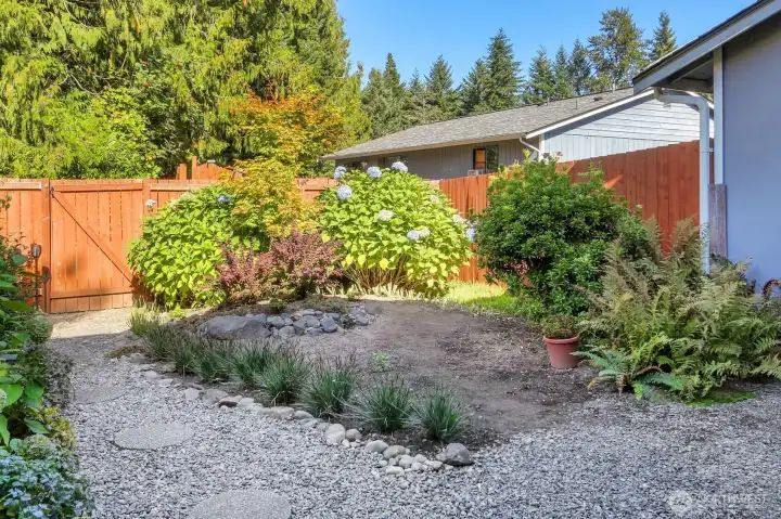 Fully Fenced Backyard with Gate to the Open Space of the Neighborhood