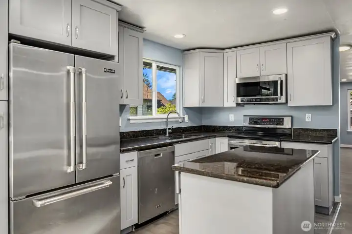 Functional center island and plenty of counter space make this kitchen perfect for cooking and gathering.