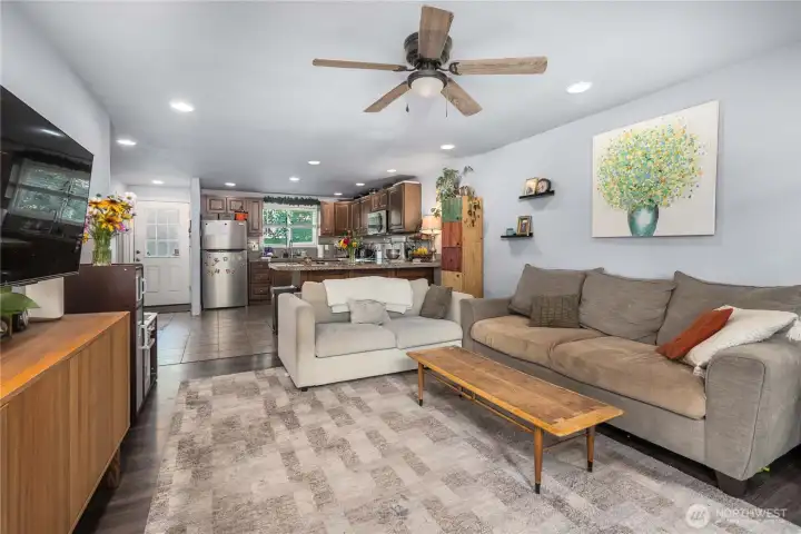 Unit 2 – Living Room: Open-concept design  Wide living room footprint easily fits multiple seating layouts and offers a clear view into the updated kitchen for better connectivity.