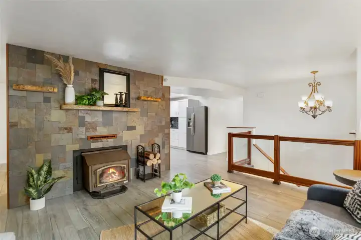 Living room on main level with wood stove