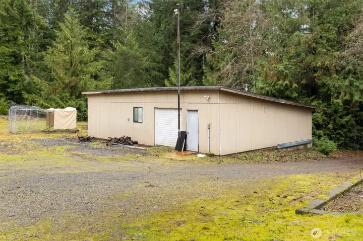 ANOTHER big shop just begging for your tools. Roll up door for easy loading/unloading and fully powered for your wood or metal working machines.