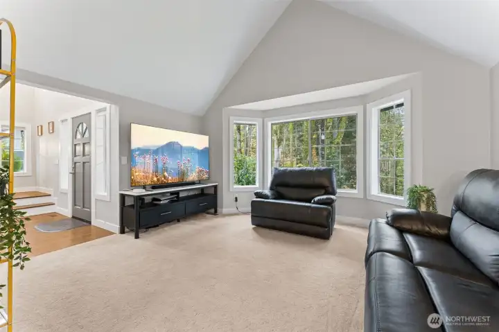 To your left upon entry you will find your formal living room. I LOVE the cathedral ceilings and large bay windows!