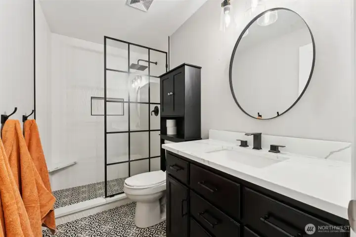 Upstairs kids/guest 3/4 bath, so nicely updated! New moisture-sensing fans in all bathrooms!