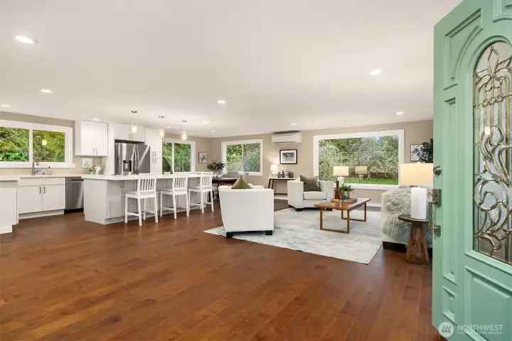 An open floor plan and picture windows to a private backyard welcome you home.