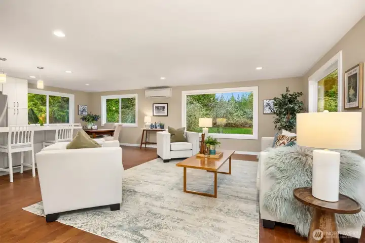 Conversation and spaces flow effortlessly from the kitchen to living & dining.