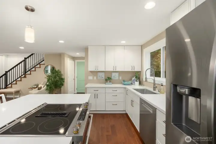 Brand new appliances- JennAir downdraft electric range, Bosch dishwasher and Samsung refrigerator.