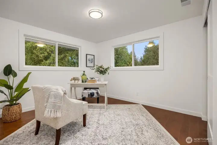 The 4th bedroom on the 2nd floor is featured as a home office