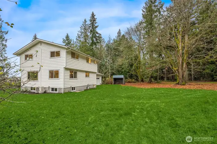 Facing southeast back to the house this leveled lot is a blank canvas waiting to be imagined. In the distance is a  covered storage shed positioned a stonesthrow from the garage.