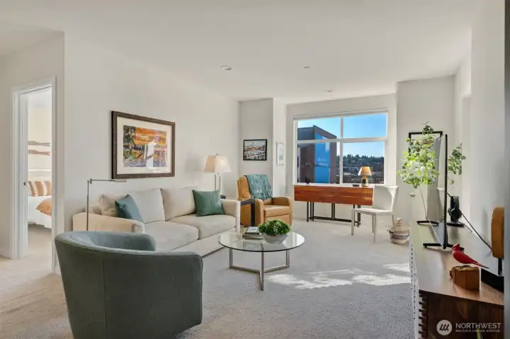 Perched on the 4th floor of Canal Station North, this light-filled residence offers a front-row seat to the best of Ballard living.