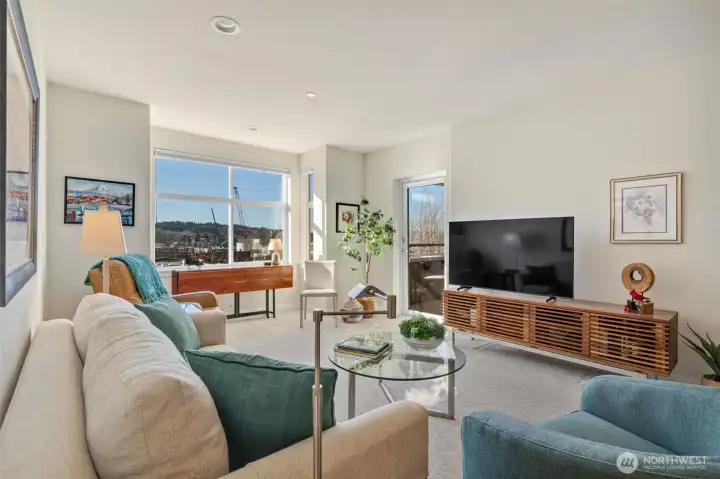 South-facing windows flood the home with natural light and capture beautiful canal and Olympic Mountain views from every room.