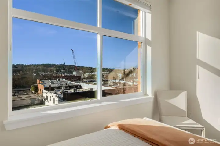 South-facing windows flood the home with natural light and capture beautiful canal and Olympic Mountain views from every room.