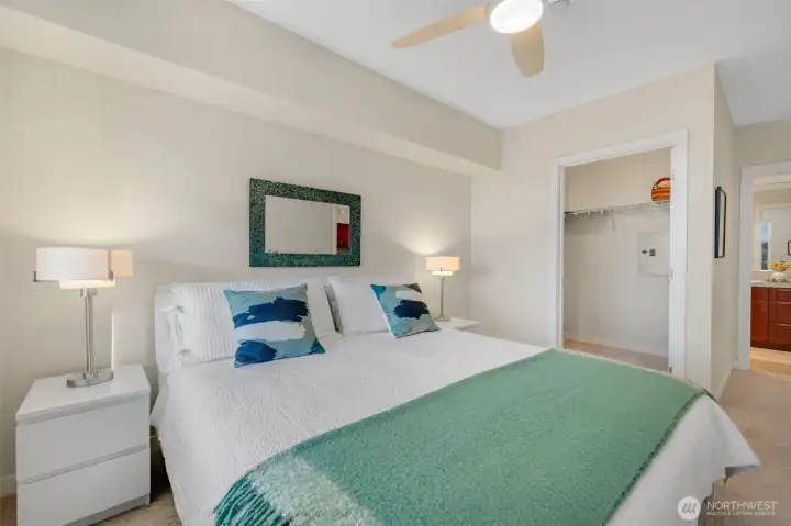 The primary bedroom comfortably accommodates a king bed and includes a walk-in closet and an ensuite ¾ bath.