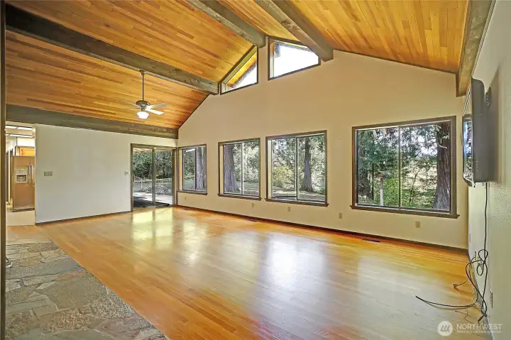 Expansive great room at back of home-space for living space plus a table and chairs.