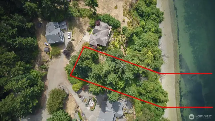 Nicely situated between beautiful homes, but enough tree line to give you privacy