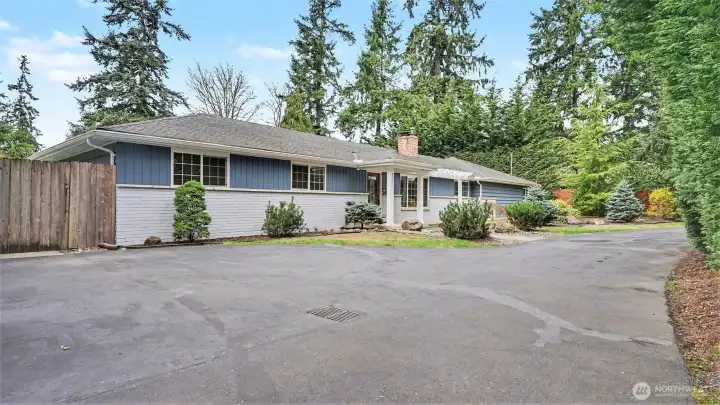 Great curb appeal with calming color palette and charming walk way surrounded by mature landscaping.