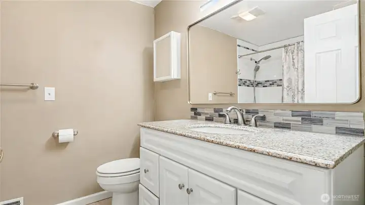 Full sized bathroom across from the guest bedrooms with plenty of counter space and storage.