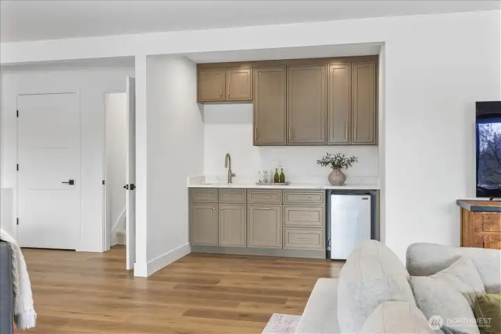 Lower level wet bar with fridge