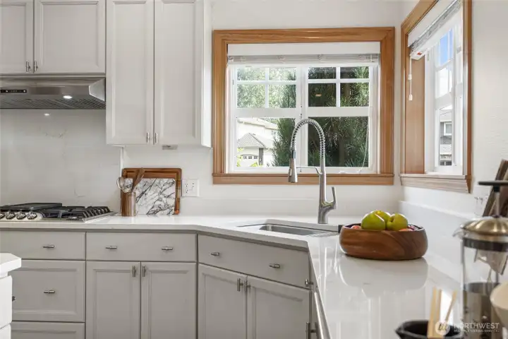 Corner wood-wrapped windows overlooking the private backyard are just one example of the thoughtful design and special details found throughout the home.