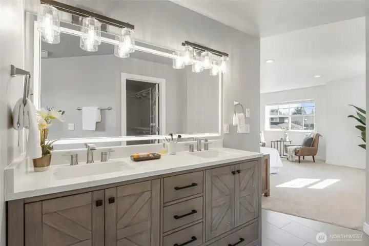 His and Hers vanities with all the light you need.