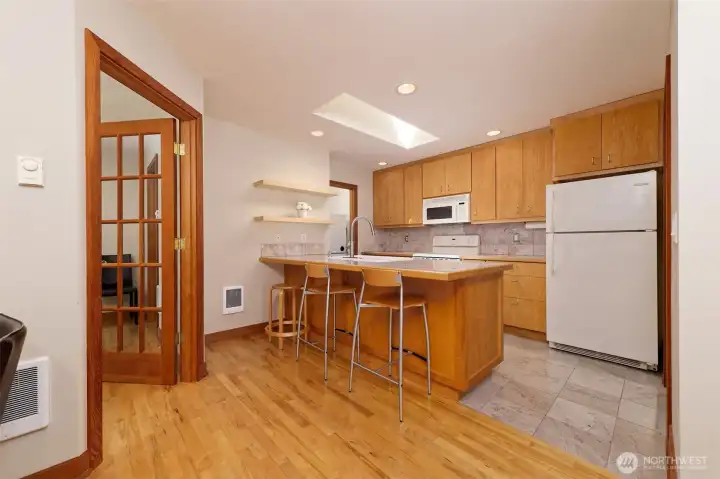 Well laid out Kitchen with eating bar and custom skylight.