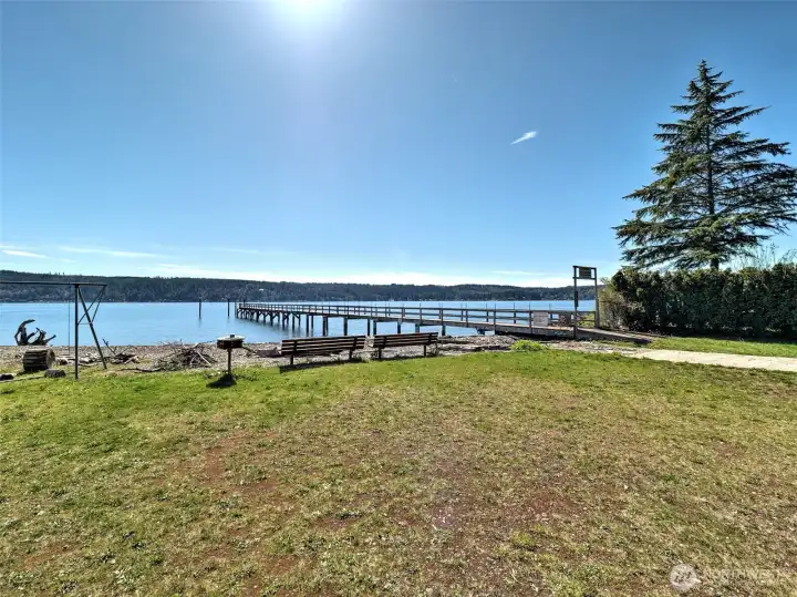 Wooded area leads to the beach boat launch and dock.