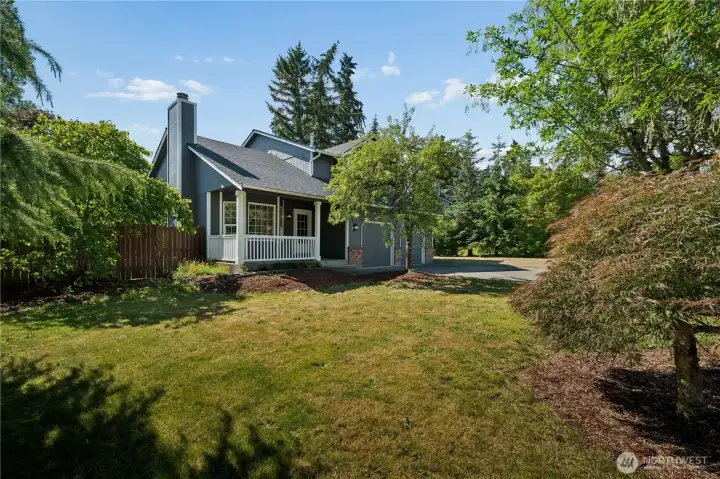 Great curb appeal sets the tone, with a welcoming front porch that's perfect for sipping your morning coffee and enjoying the peaceful surroundings.