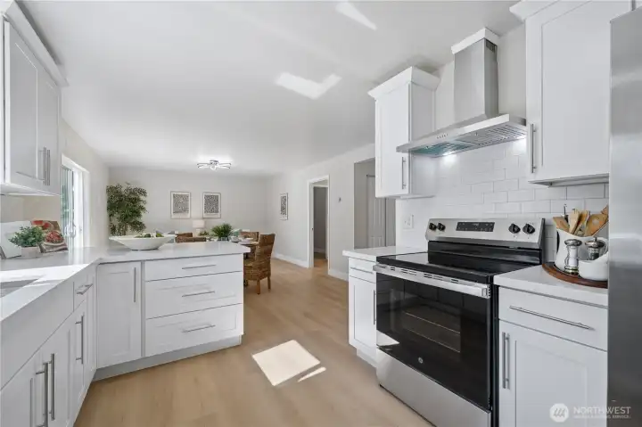 The dining room is conveniently connected to the beautifully updated kitchen.