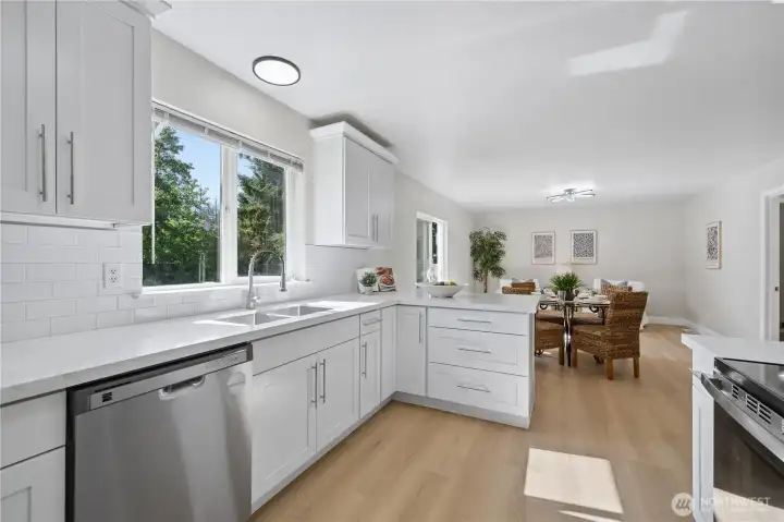 The kitchen opens to a casual eating nook, ideal for everyday meals.