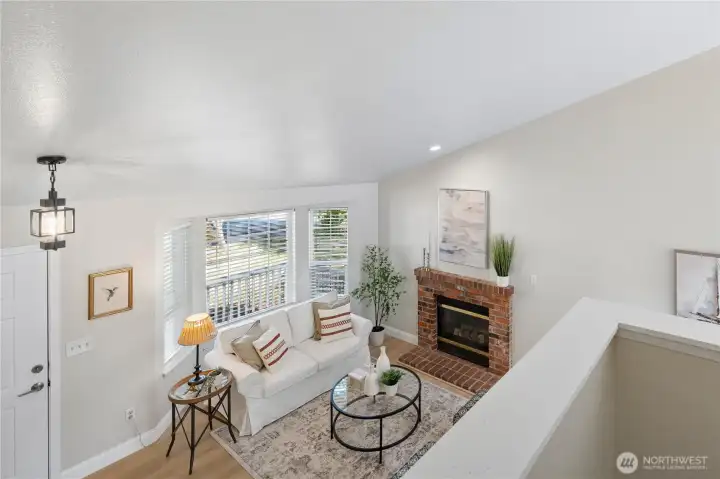 Upstairs, the open landing overlooks the living room below and leads to three spacious bedrooms, including the primary suite.