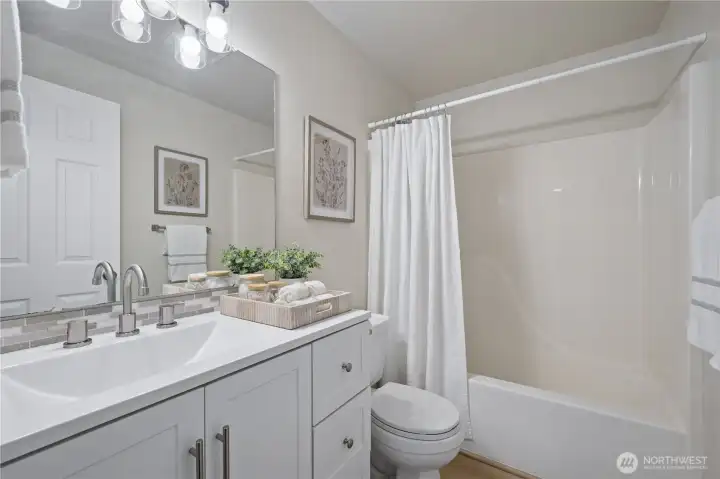 The upstairs full bath has been tastefully updated with modern finishes.