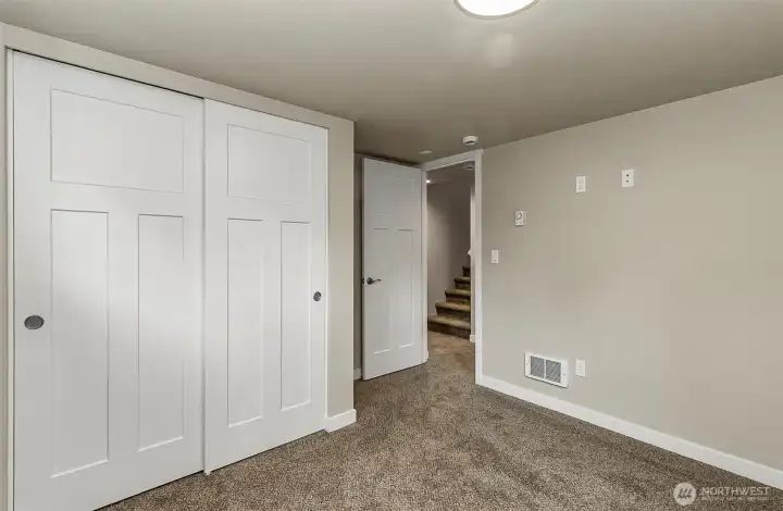 Downstairs #2~ Large closet~ shows leading into upstairs~ New carpet throughout~