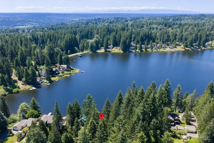 This gorgeous property is partially wooded which allows for summer shade. The red indicator is where the lot sits on the lake.