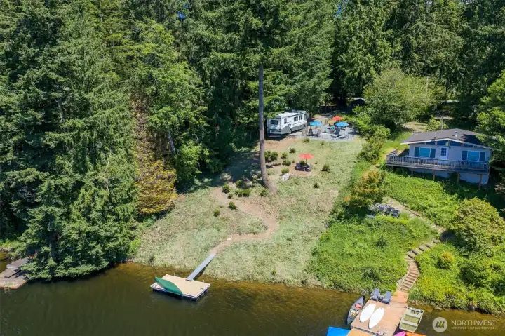 Trail leads to the floating dock. Bring your electric motor boat, kayaks, and water toys! If you like to fish for trout or bass bring your pole. The lake is stocked yearly with trout!