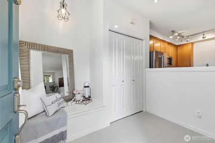 Entryway with built in seating and coat closet