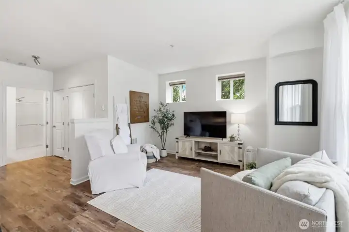 Open living room, tall ceilings with lots of natural light