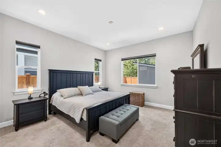 The Primary Bedroom is large, and has a lot of natural light. Electric blinds here, too. Convenient! The Primary Bedroom is large, and has a lot of natural light. Electric blinds here, too. Convenient!